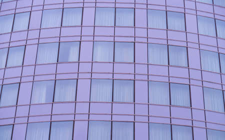 Glass facade of a modern building, horizontal and vertical lines, architectural backgroundの写真素材