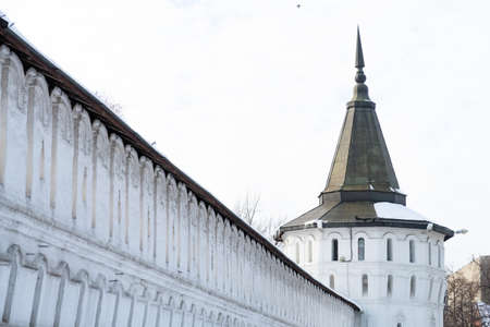 The high wall and the white-stone Nagornaya tower of the Danilov monasteryのeditorial素材