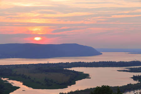 View of the Zhigulevsky mountains and the Volga from a high river bank at sunset, Samara, July, 2021