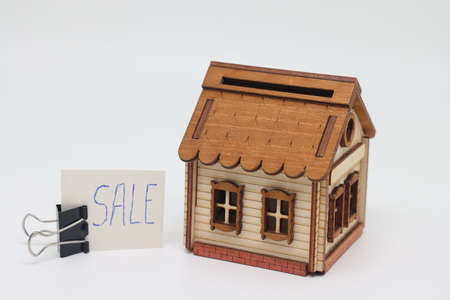 White toy house and sticker for sale, real estate sale.の写真素材