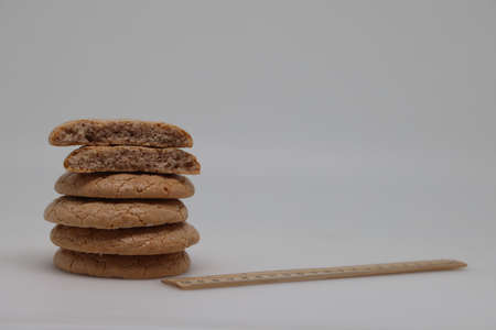 Nut cookies on electronic kitchen scales, accurate calorie counting, proper nutritionの写真素材