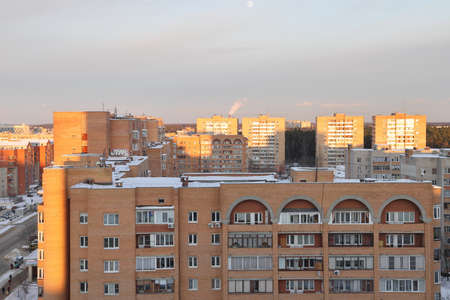 New snow covered high rise residential buildings in a Russian city. Moscow region, January 2022の写真素材