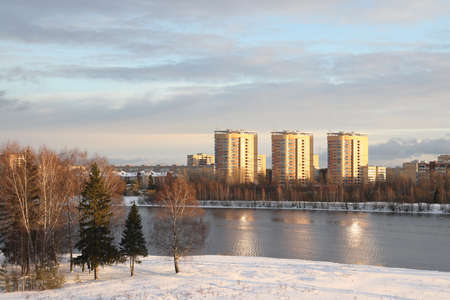 river on a sunny evening. Trees and shrubs. Landscape of winter nature, river banks overgrown with bushesの写真素材