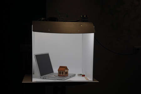 Lightbox for photo stock. Photographing objects is done using a light box and a digital camera