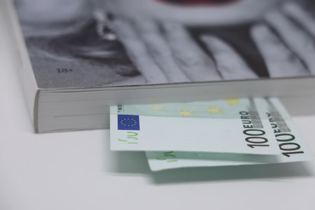 banknotes are invested in the book, banknotes between the pages of the book, bookmark