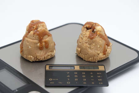 Cakes on electronic kitchen scales. unhealthy foods. The concept of a healthy lifestyle. diet...