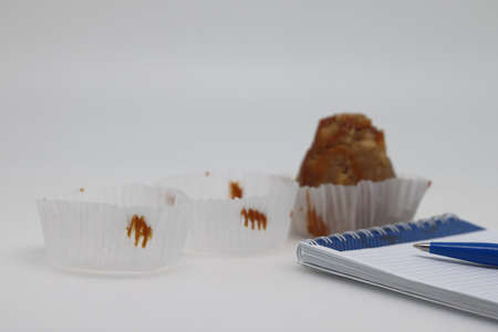 Sweet cakes. Empty paper roses for cakes. unhealthy foods. The concept of a healthy lifestyle. diet violation. weight controlの写真素材