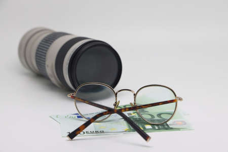 Camera, money, glasses, lens and Travel concept image: traveler accessories. Earnings on photo stocksの写真素材