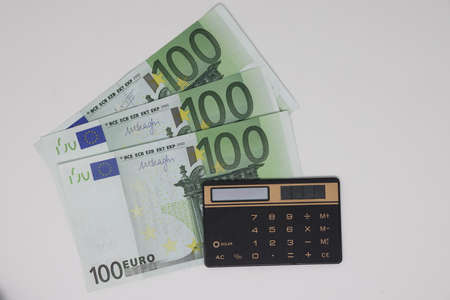 Close up, top view. Accounting and control of the family budget. Money calculator to save