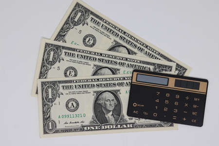 Close up, top view. Accounting and control of the family budget. Money calculator to save