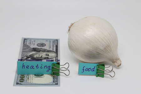 Dollar bills inserted into the radiator slots of the heating system, the increase in the cost of...
