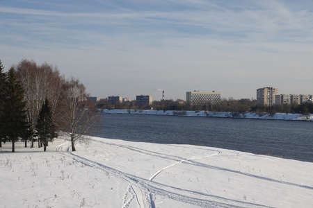 river on a sunny evening. Trees and shrubs. Landscape of winter nature, river banks overgrown with bushesの写真素材