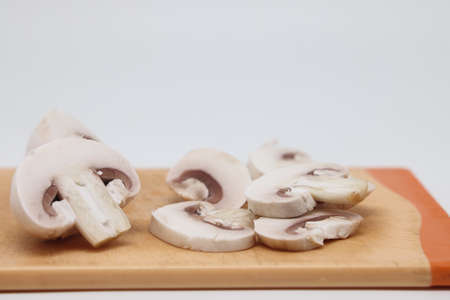 Sliced champignons, close up, isolated on white backgroundの写真素材