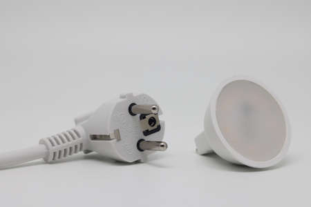 White electric cable and banknotes, expensive electricity, saving electricity