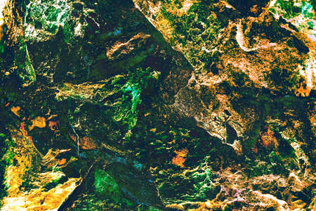 A fragment of masonry, a piece of the wall of an old house, changed colors, pastel colors. Texture of stone wall for backgroundの写真素材