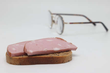 Sliced boiled delicious sausage on a white background, sausage sandwich, proper nutritionの写真素材
