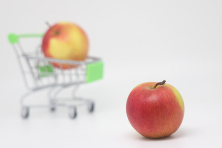Tiny fruit in the supermarket cart. The concept of healthy eatingの写真素材