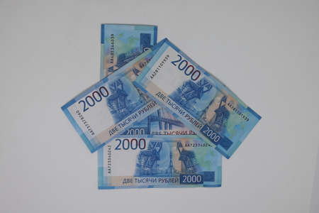 Banknotes laid out in the shape of a house. Real estate, real estate investment, mortgage rate, utility bills, top view, flat layの写真素材