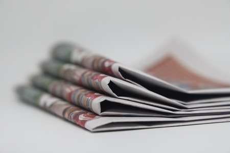 Rolled up stack of newspapers, news, corrupt journalism
