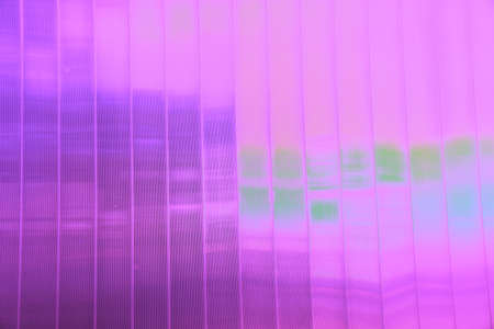 background of glass windows of a modern office building, glass facade, changed color schemeの写真素材