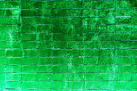 Red white wall background. The texture of the old brick wall is horizontal. brick background. vintage wall with peeled plaster. Retro grunge wall. Changed color schemeの写真素材