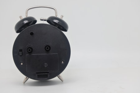 Alarm clock back view, reverse side of time, dark side of timeの写真素材