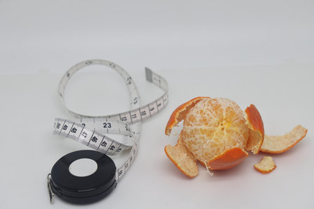 Peeled tangerine or mandarin fruit isolated on white background cutoutの写真素材