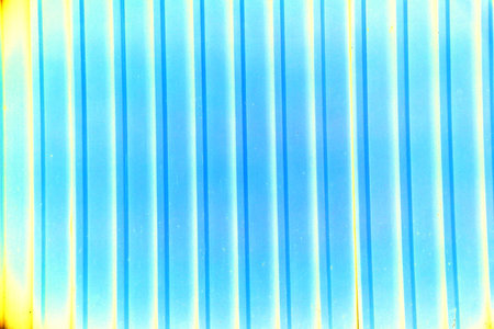 Ribbed wall of the shipping container. abstract blue and yellow color background with vertical stripes and linesの写真素材