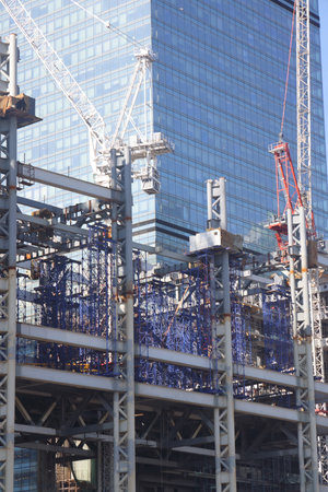Construction site with cranes on sky backgroundの写真素材