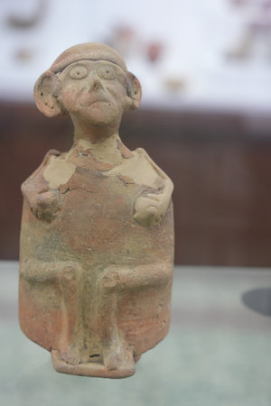 Clay figurine of male, pottery, close-up photo, Neolithic period, Archaeological Museum in Konya, Turkeyのeditorial素材