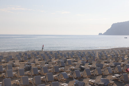 Storm on a sandy beach on a cloudy, rainy evening, mediterranean sea, peaceful landscape, alanya, turkey, may 2023の写真素材