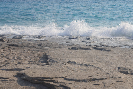 Relict flat rocks on the beach in Alanya, July 2024の写真素材