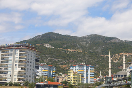 residential development against green mountains, Alanya, Turkey, April 2025の写真素材