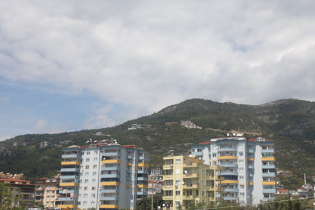 residential development against green mountains, Alanya, Turkey, April 2025の写真素材