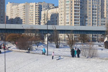 winter landscape park Yuzhnoye Butovo against the background of the ground metro line, Moscow, March 2024の写真素材