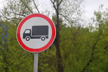 prohibitory road sign for trucks against the background of a forest, no entry, ecologyの写真素材