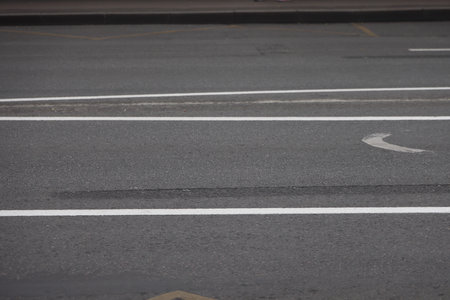 curb along the highway, asphalt and lawn along the road, minimalism 5の写真素材