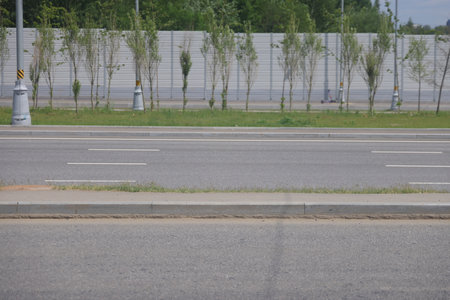 curb along the highway, asphalt and lawn along the road, minimalism 5の写真素材