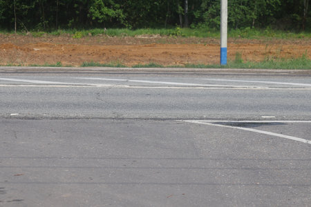 road markings on the roadway, roadside, curb, minimalismの写真素材