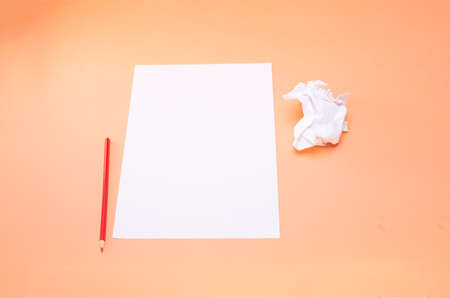 blank sheet of paper and red pencilの写真素材
