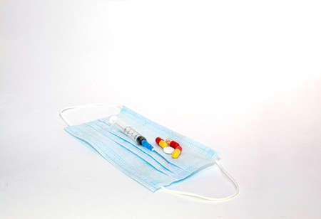 medical mask, pills and syringeの写真素材
