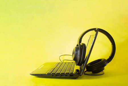laptop and headphones colored backgroundの写真素材