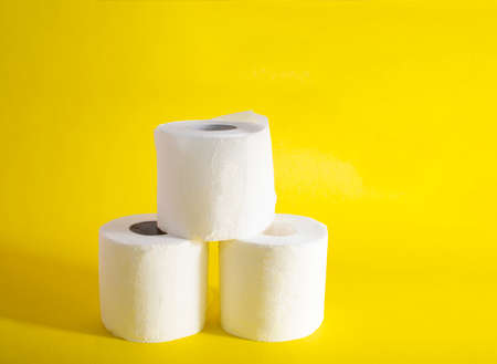 Toilet paper on yellow backgroundの写真素材