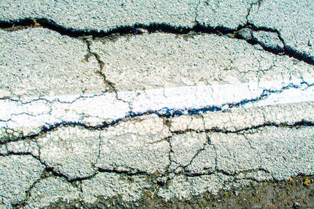cracks in the asphalt in the city