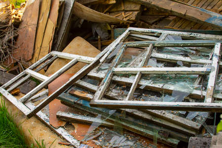 Broken wooden window frames in a scrapyard after an earthquake.の写真素材