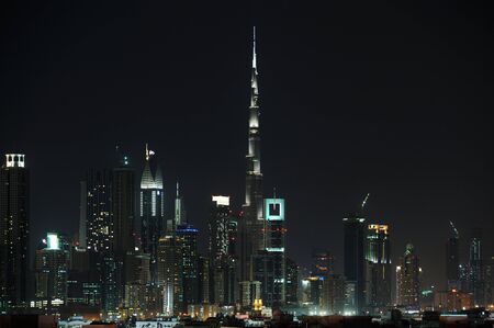 Dubai World Trade center and Burj Khalifa an night.のeditorial素材