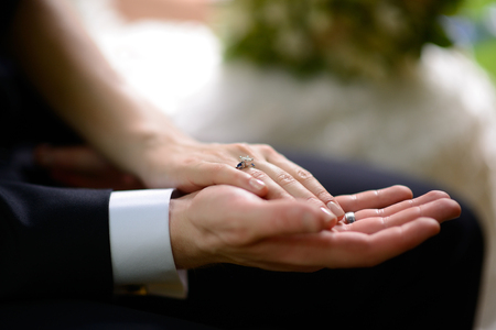 Groom holding bride's hand.の写真素材