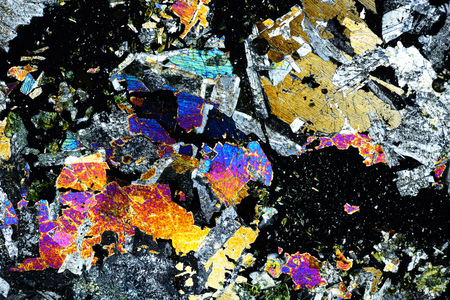 Colorful micro crystals of rock in polarized light.