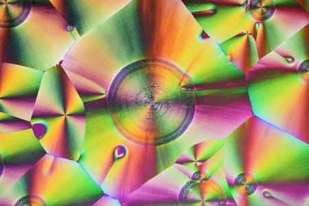 Colorful micro crystals in polarized light. Photo through a microscope.の写真素材