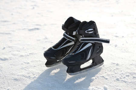 Ice-skates on ice surafce in winter.の写真素材